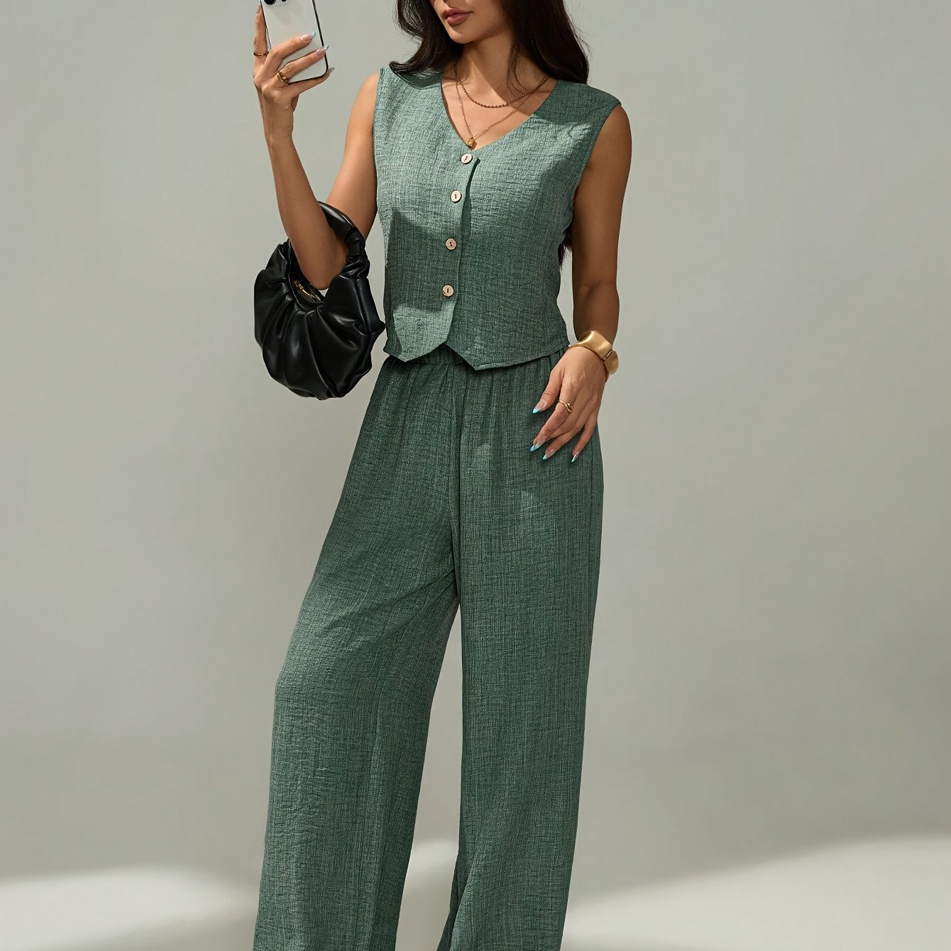 Women's elegant two-piece set - sleeveless top and wide-leg pants with button details