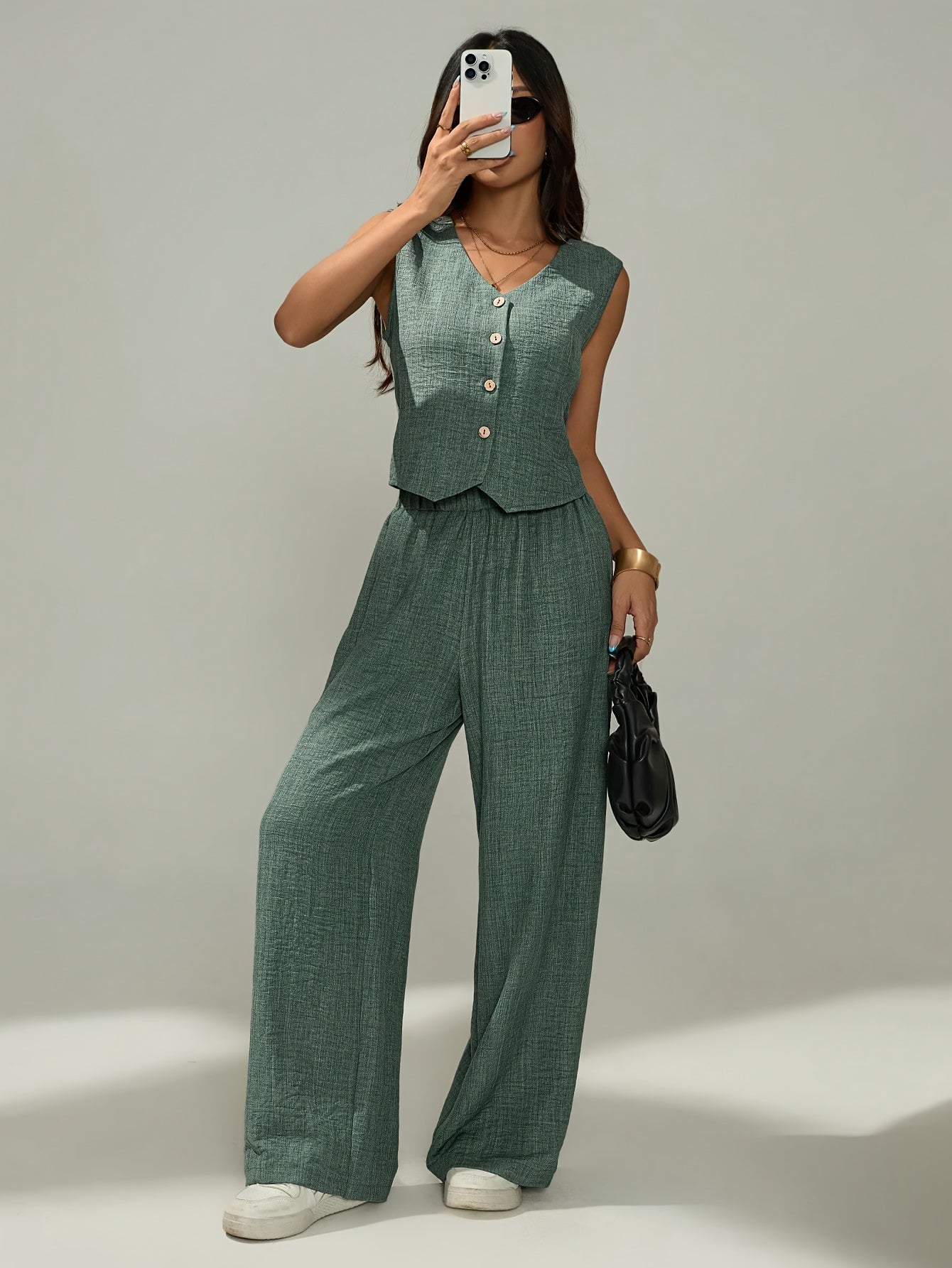 Women's elegant two-piece set - sleeveless top and wide-leg pants with button details