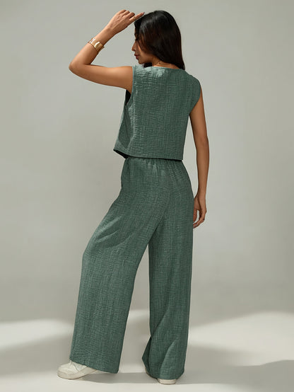 Women's elegant two-piece set - sleeveless top and wide-leg pants with button details